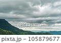 Time lapse of rain clouds wave rapidly over the densely forested mountains before the rain. 105879677