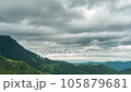 Time lapse of rain clouds wave rapidly over the densely forested mountains before the rain. 105879681