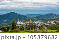 Time lapse of The landscape of Wat Phra That Pha Son Kaew with its five large white Buddha images is unique and features mountains, sky and rain clouds. 105879682