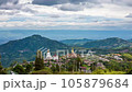 Time lapse of The landscape of Wat Phra That Pha Son Kaew with its five large white Buddha images is unique and features mountains, sky and rain clouds. 105879684