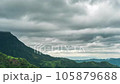 Time lapse of rain clouds wave rapidly over the densely forested mountains before the rain. 105879688
