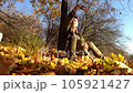a girl takes selfie at sunset in autumn beautiful forest 105921427