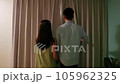 happy asian couple watching outside 105962325