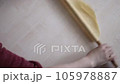 woman rolling dough with rolling pin to make pies, rolling thin dough and rolling pin, 105978887