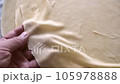 woman rolling dough with rolling pin to make pies, rolling thin dough and rolling pin, 105978888