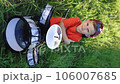 Vertical video of smiling drummer boy crossed arms smiling at camera posing. Happy caucasian kid boy drummer. Guy playing on drum kit. Emotional portrait. Cheerful little boy playing drums. 106007685
