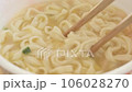 Picking up instant cup udon with chopsticks 106028270