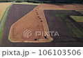 Combine harvesting: aerial view of agricultural machine collecting golden ripe wheat into truck. 106103506