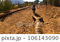 Group of people ride horses by mountain side trail in Turkey 106143090
