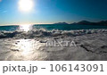 slow motion of tide waves with foam and splashes breaking over the camera 106143091