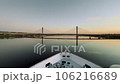 Nile Sunrise Serenity: Cruise Ship Under Bridge 106216689