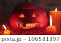 Halloween concept, composition of pumpkins and candles, Jack's lantern from pumpkin, scary laughing pumpkin 106581397