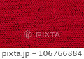 Close-up of red texture fabric cloth, textile background. Movement towards the viewer. Macro zoom.  106766884
