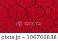 Close-up of red texture fabric cloth, textile background. Movement from left to right. 106766888