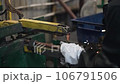 Welder makes metal products using contactless welding machine. Production of metal products 106791506