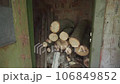 Stacked firewood indoors 106849852
