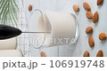 Making milk foam from vegan almond drink with automatic rotating milk frother, speed up video clip, using milk foam maker to prepare foam for coffee drinks, 4k footage 106919748
