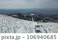 Aerial drone shot of the frost-covered forest and cable car at Zao Onsen Ski Resort 106940685