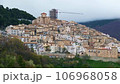 village of Castel del Monte with cranes and construction sites for restoration after earthquake of 106968058