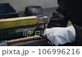 Welder makes metal products using contactless welding machine. Production of metal products 106996216