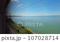 View through the train window to the Black Sea shore near the city of Sochi. 107028714