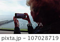 A woman goes on vacation to the Black Sea in the city of Sochi.  107028719