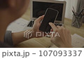 Close-Up of Hand Touching Smartphone Screen: Modern Communication Technology, Touch the phone screen, Mobile Device for Digital Connection, Go no internet. 107093337