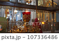 Lighted candles in an Orthodox church 107336486