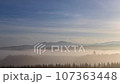 Disappearing morning mist of the Daisetsuzan mountain range 107363448