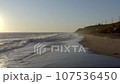 California Shoreline Sunset Flight over waves along cliffs 107536450