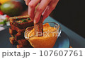 Dipping in sauce delicious crispy toast 107607761