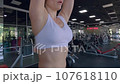 Woman is exercising in the gym. 107618110