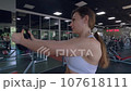 Woman is exercising in the gym. 107618111