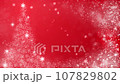 Christmas tree and falling snowflakes particles, red background 107829802