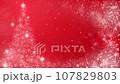 Christmas tree and glitter particles, red background 107829803