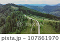 amazing Carpathian landscape with a church on the mountain 107861970