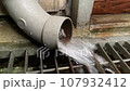 water coming out of the pipe 107932412