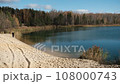 Autumn transparent clean lake with white sand beach in the forest 108000743