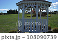 Handheld Shot of a Small Gazebo on Scenic Country Farm Land 108090739