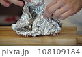 Meat steak in aluminum foil. 108109184