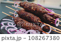 Fried and juicy grilled meat lies on a plate 108267380