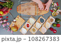 Transferring rye bread to a glass dish 108267383