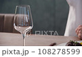 Pouring Red Wine In To a cup of Glass 108278599