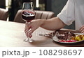 Close-up, a man's hand takes a glass of wine. 108298697