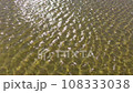 Nature texture of running ripple on the water. Moving background with meditative and hypnotic effect. 108333038