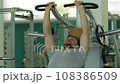 Young man doing exercise for the chest muscles 108386509