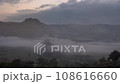 The morning fog on the eastern side saw the movement of orange clouds hitting the sun at Phu Lanka, Phayao Province, Thailand. 108616660