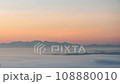The fog movement. It's the same as the waves of the sea. Orange light in the morning at sunrise. 108880010