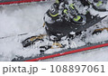 Preparing for backcountry skiing and installing bindings 108897061