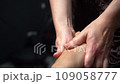 Professional foot massage. Authentic footage of luxury spa treatment. Charming light. Shallow depth of field. Stylized and colored. 109058777